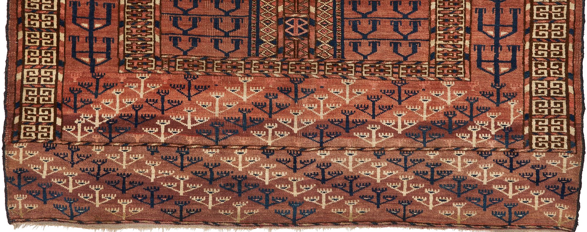 border of an antique turkmen rug with tree motifs