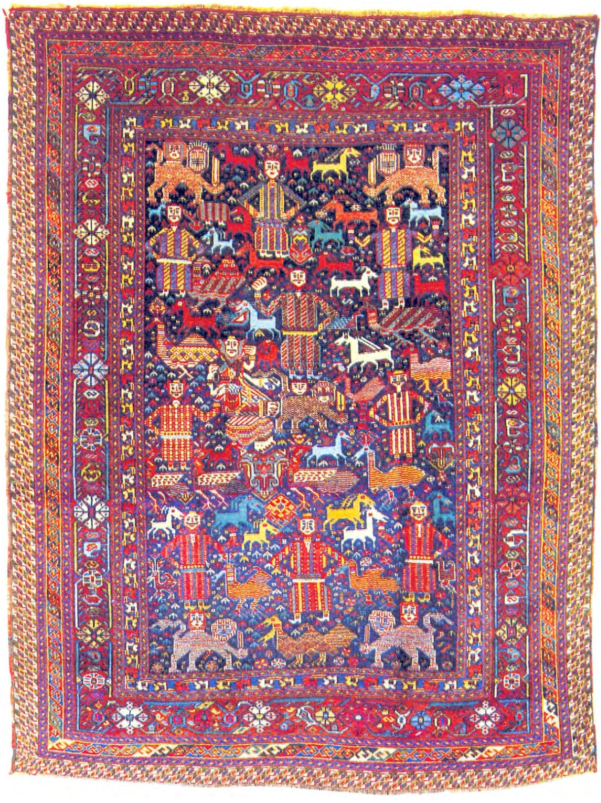 Hand-knotted Arab Jinni rug with a dark blue field crowded with standing people, lions with human faces, horses and birds, inside layered red borders.