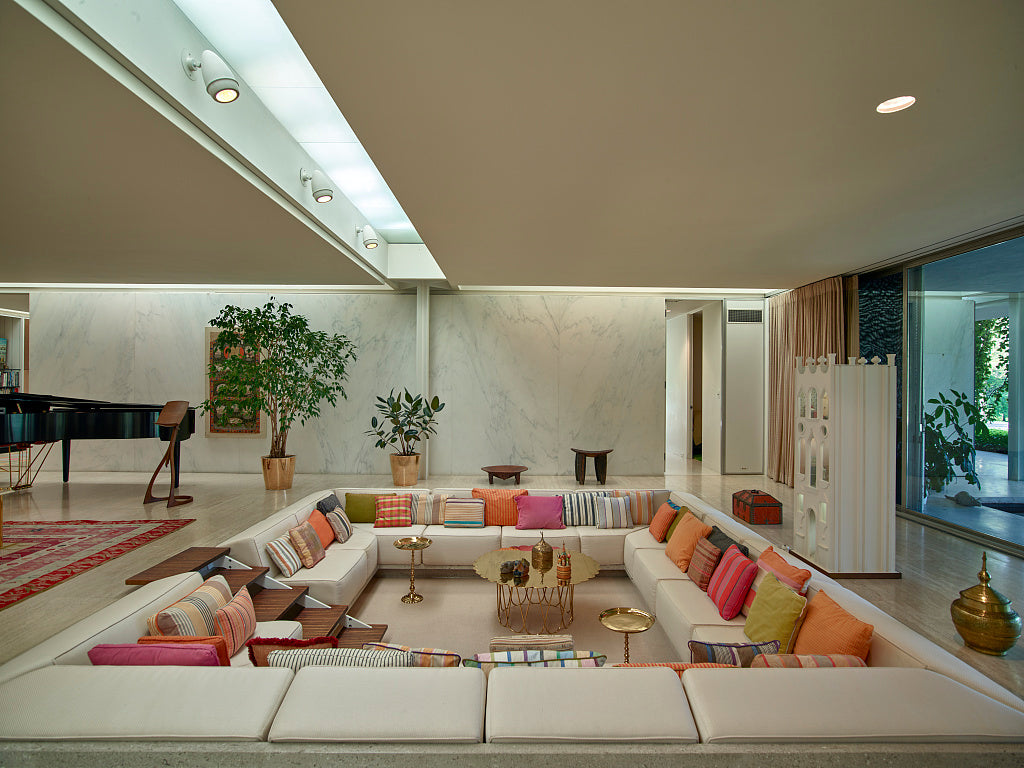 Miller House conversation pit with pale seating, striped cushions and a light rug, photographed in 2016