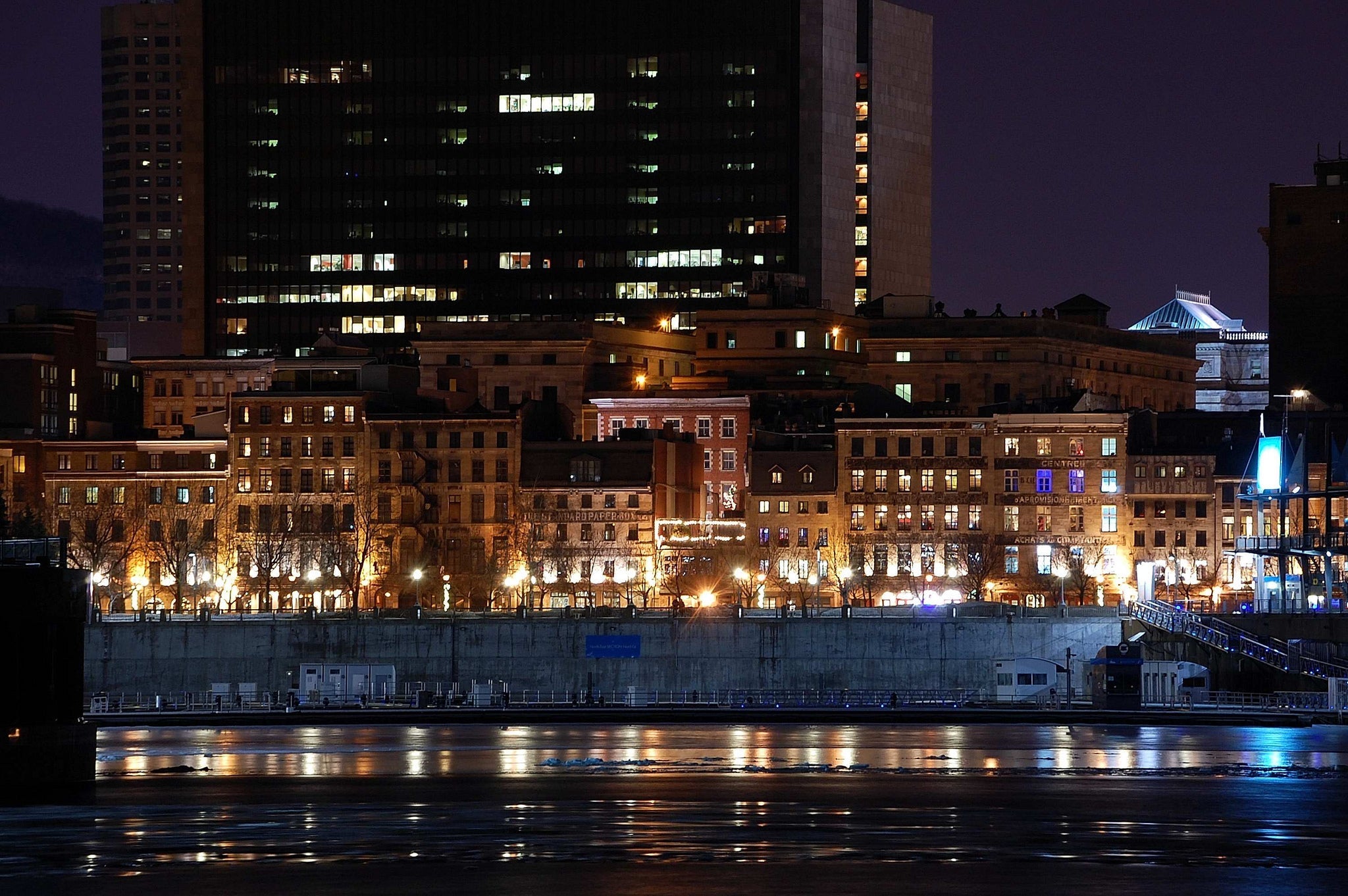 Old Montreal waterfront at night, illustrating the city rather than a rug showroom