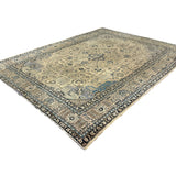 Vintage Tabriz Rug, angled view showing the full field and borders, hand-knotted wool pile. SKU 0005.