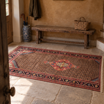 Koliayi rug before an elm entrance bench; AI-generated styling visualization. Pattern details and scale may vary; refer to original product photos and listed dimensions.