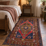 AI-generated lifestyle visualization of the vintage Yahyali rug, 113 × 197 cm, placed beside a bed; original product photos show the actual rug.