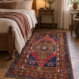AI-generated lifestyle visualization of the vintage Yahyali rug, 113 × 197 cm, placed beside a bed; original product photos show the actual rug.