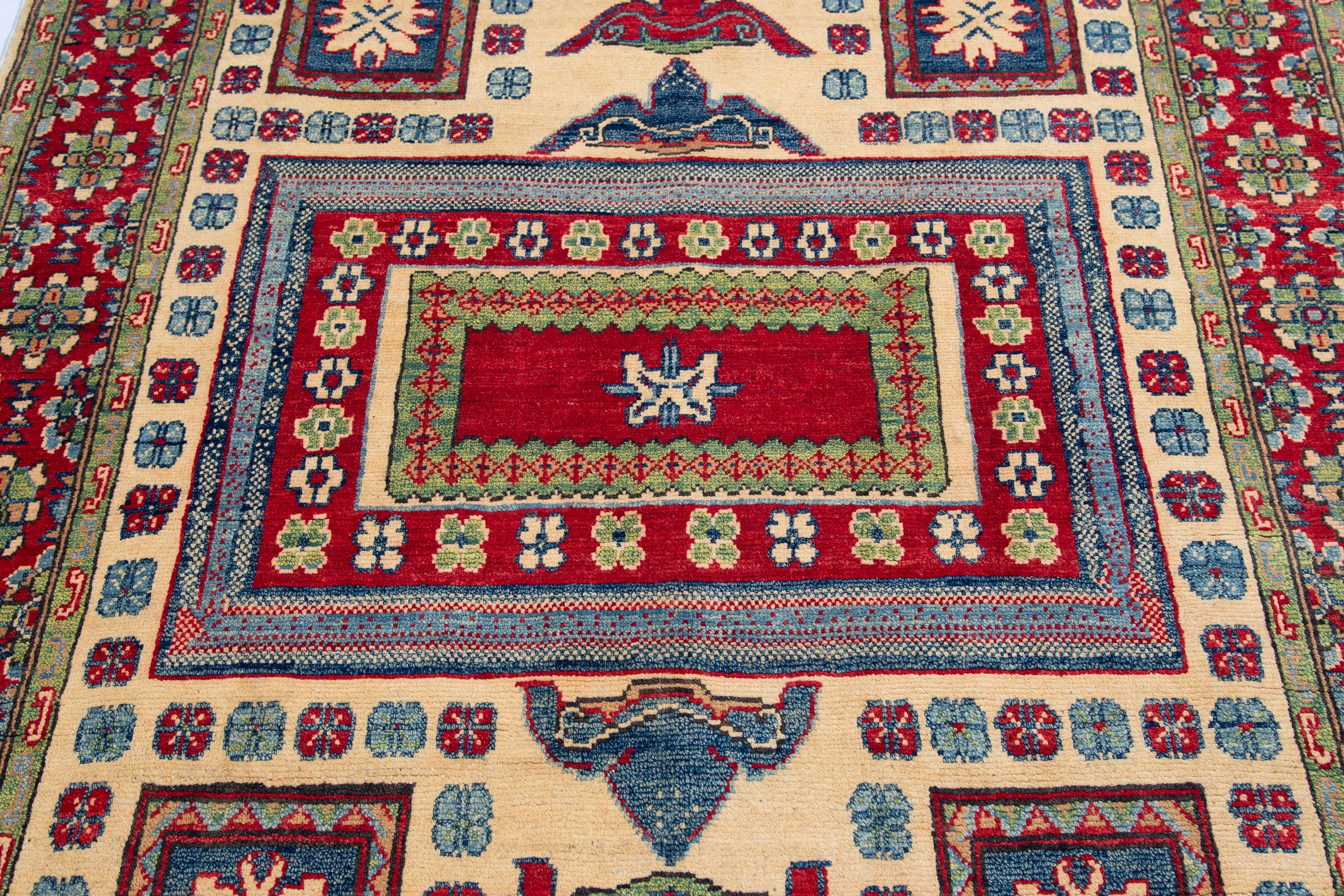 Pattern detail of ivory & red Kazak-inspired wool rug 19311.