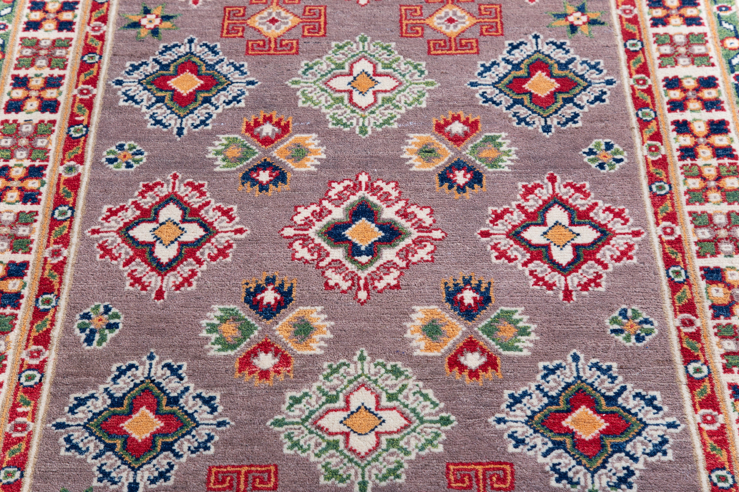 Pattern detail of blue & red Kazak-inspired wool rug 19944.