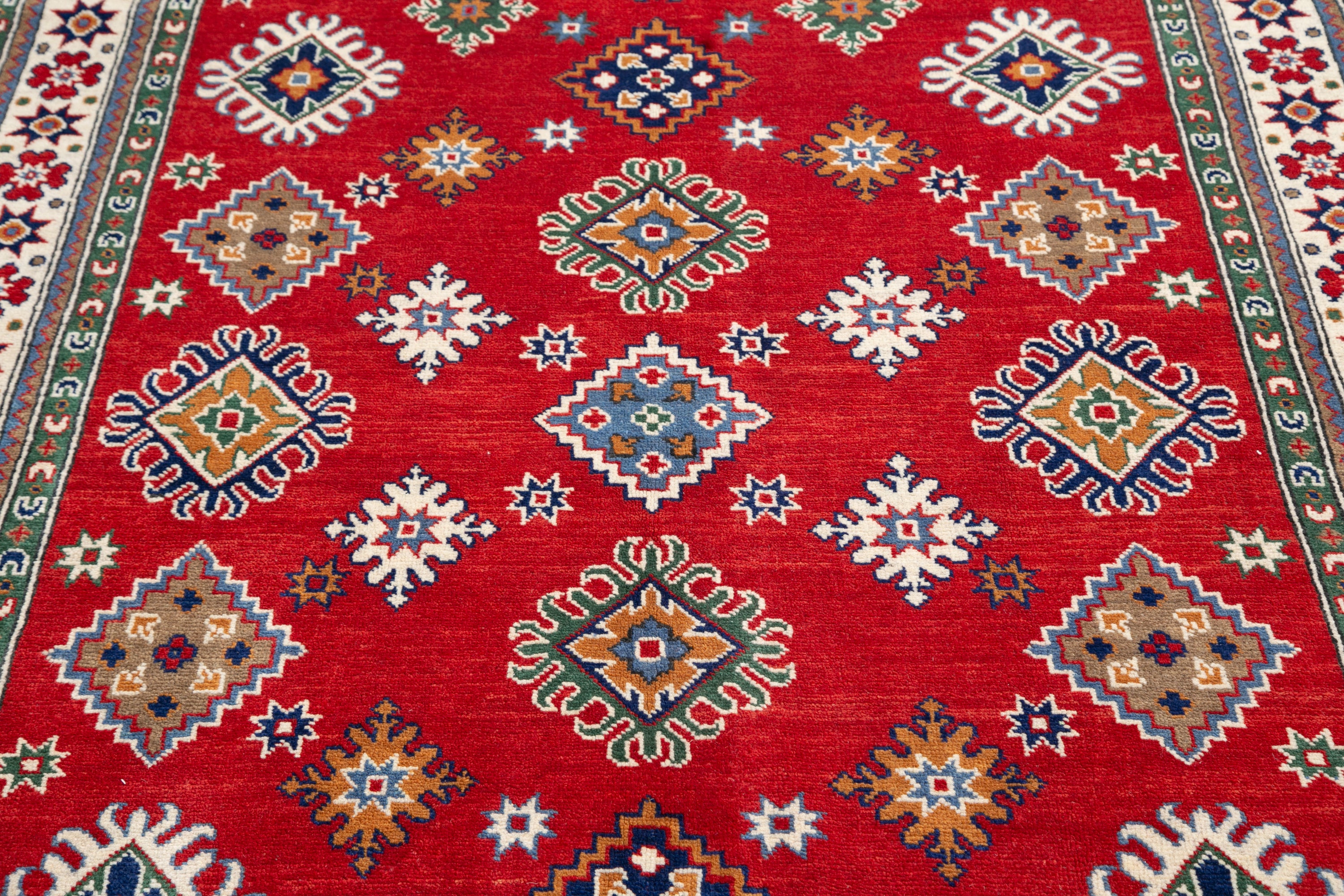 Pattern detail of red & blue Kazak-inspired wool rug 21414.