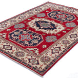 Full view at an angle of red & blue Kazak-inspired wool rug 21421.