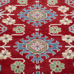 Pattern detail of red & blue Kazak-inspired wool rug 21423.