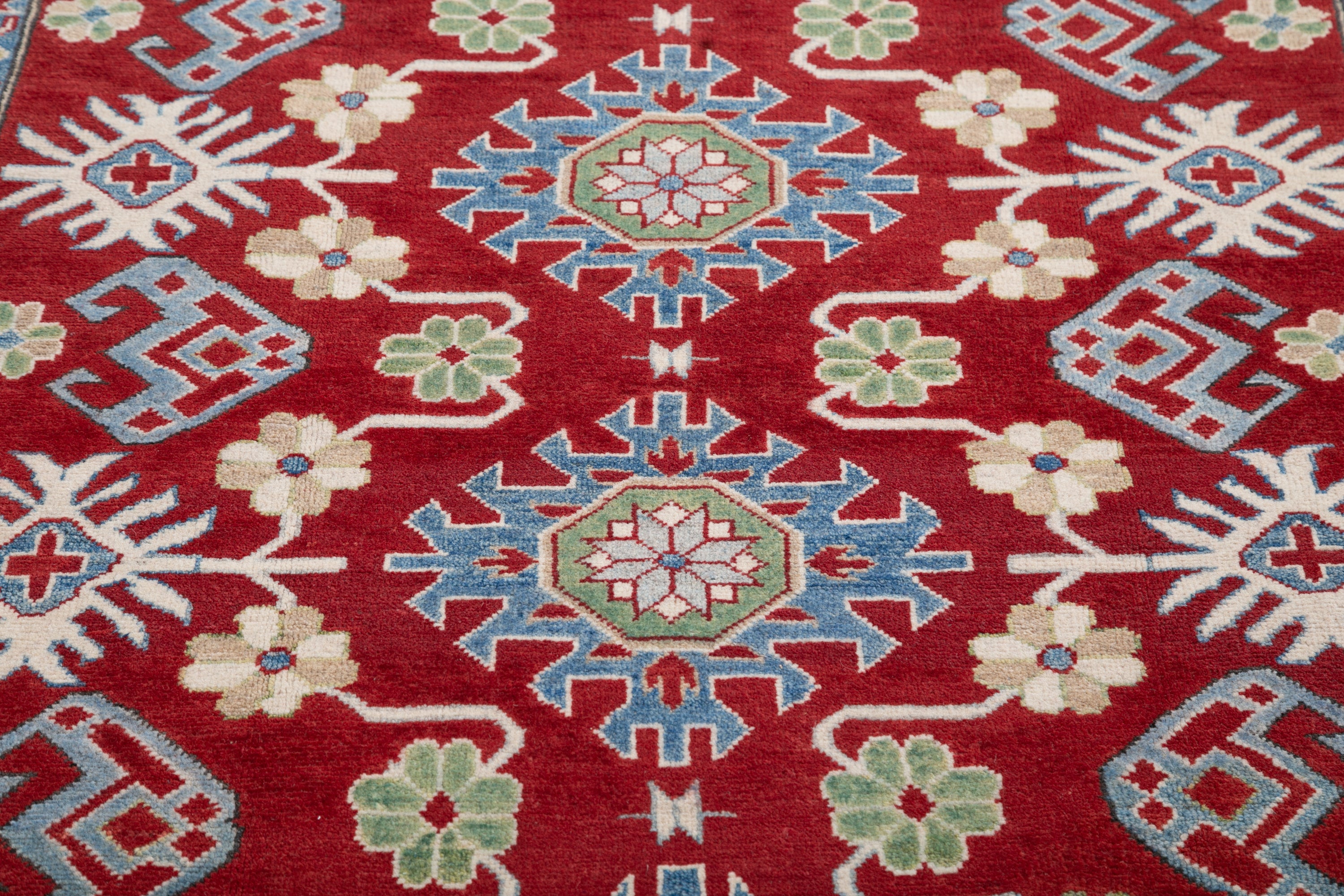 Pattern detail of red & blue Kazak-inspired wool rug 21423.