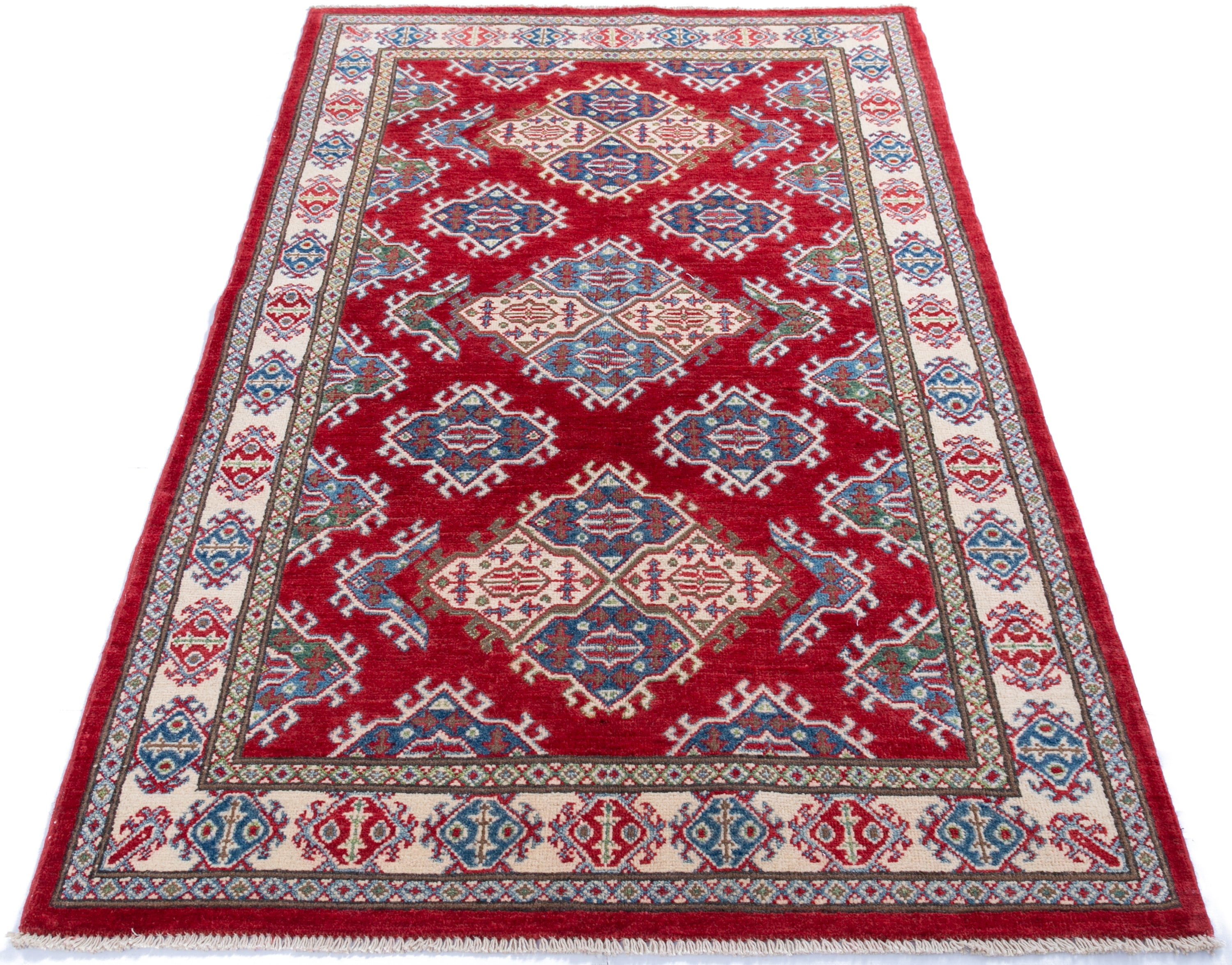 Full view from a low angle of red & blue Kazak-inspired wool rug 21434.
