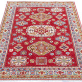 Full view from a low angle of red & yellow Kazak-inspired wool rug 21471.
