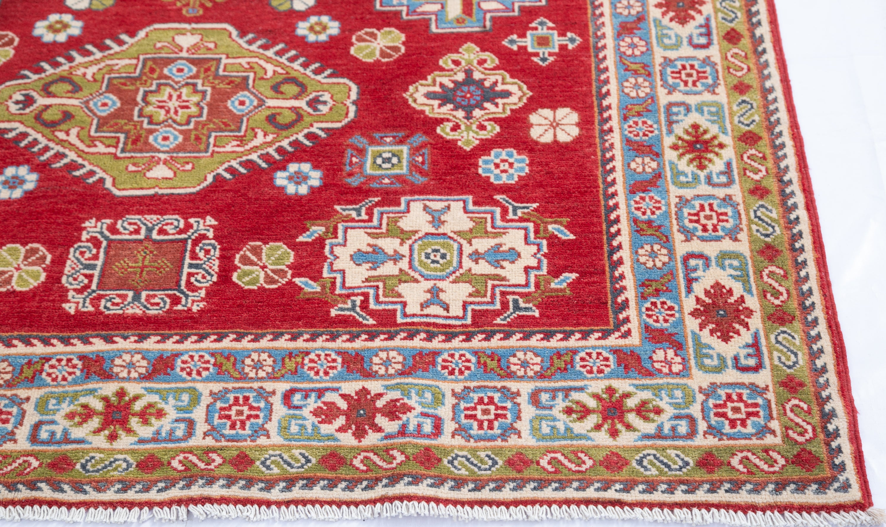 Border and edge detail of red & yellow Kazak-inspired wool rug 21471.