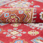 Folded edge and wool pile of red & yellow Kazak-inspired wool rug 21471.