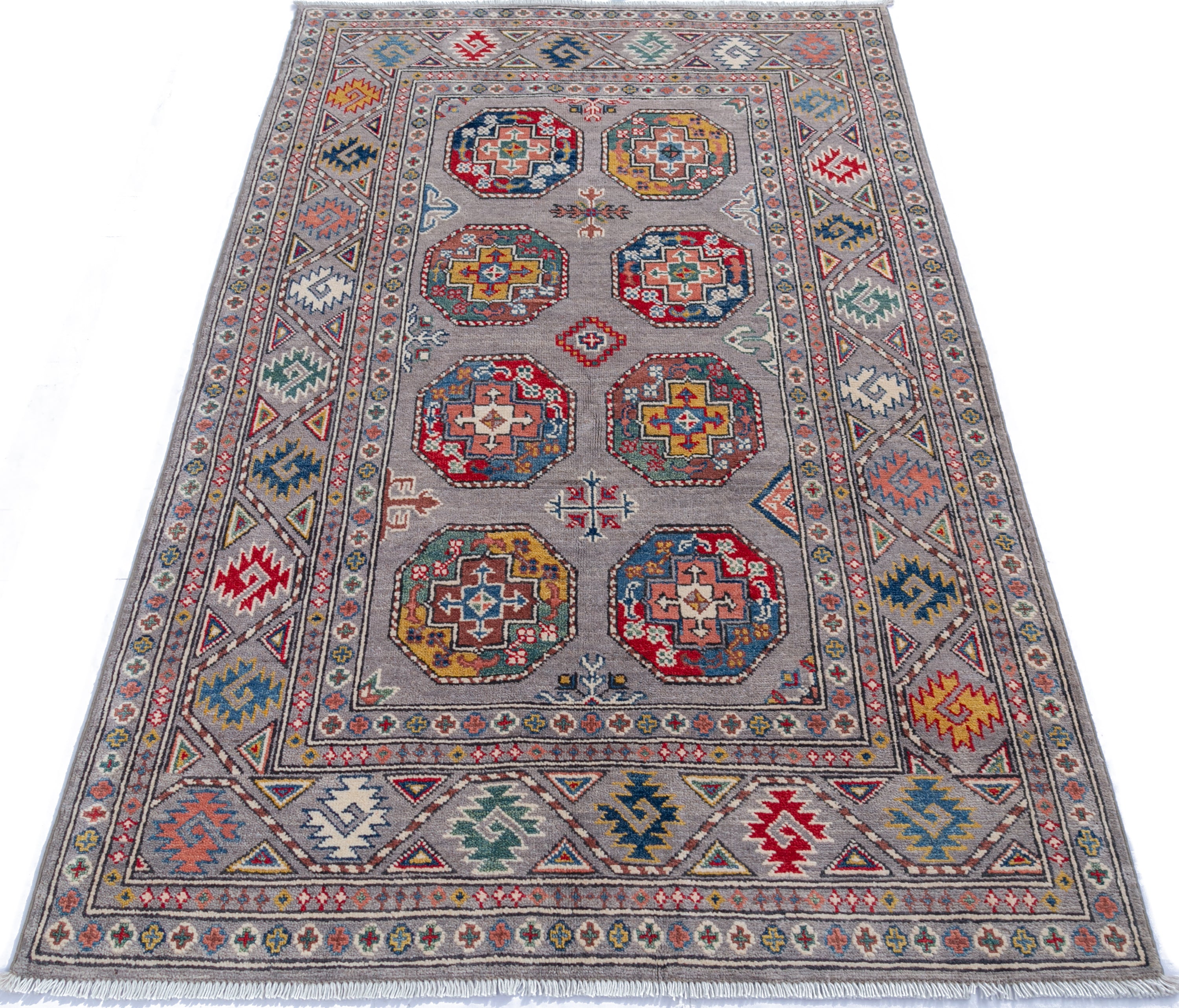 Full view from a low angle of blue & red Kazak-inspired wool rug 21479.