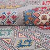 Folded edge and wool pile of blue & red Kazak-inspired wool rug 21479.