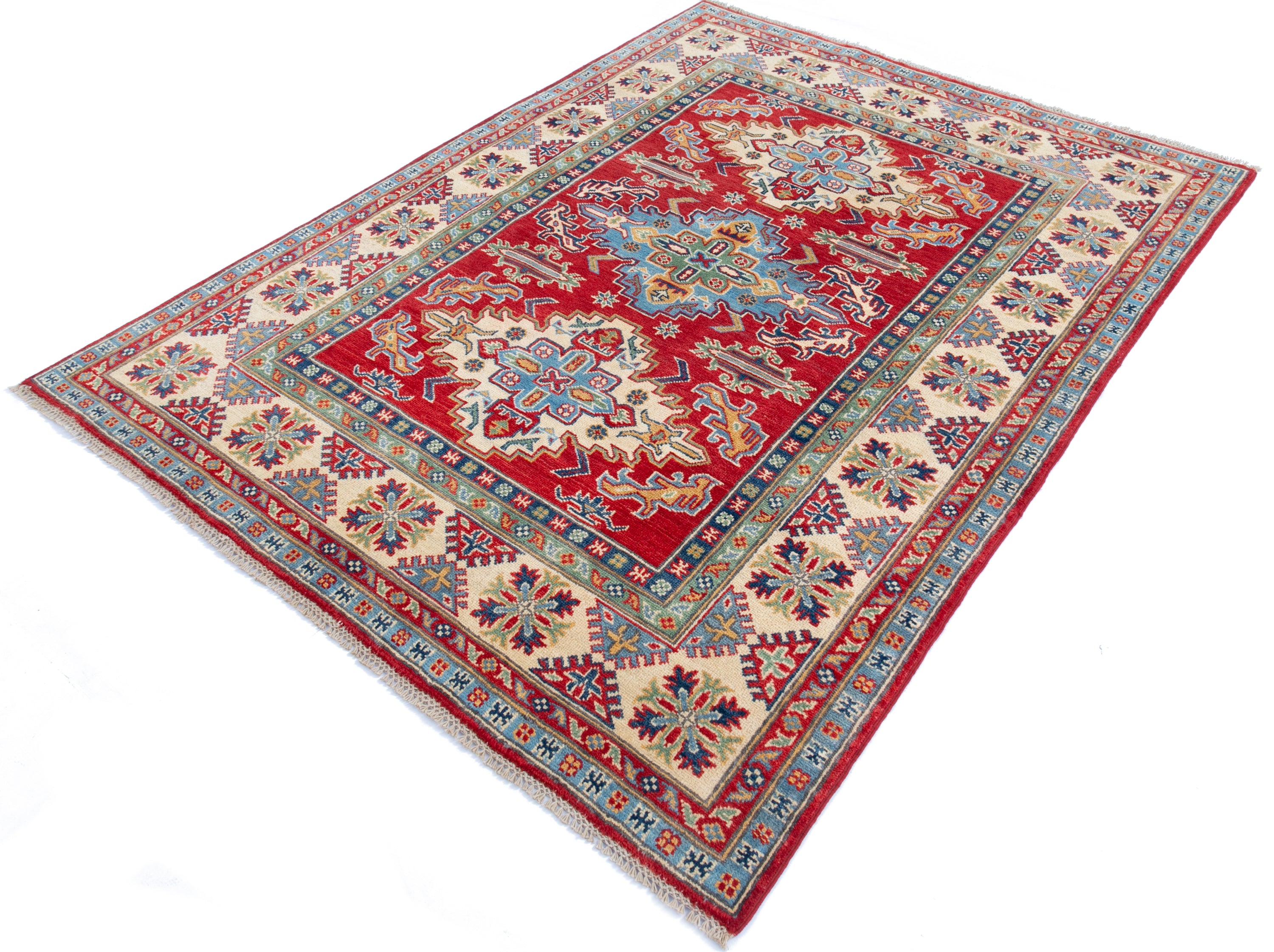 Full view at an angle of red & green Kazak-inspired wool rug 21525.