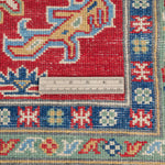 Border and edge detail of red & green Kazak-inspired wool rug 21525.