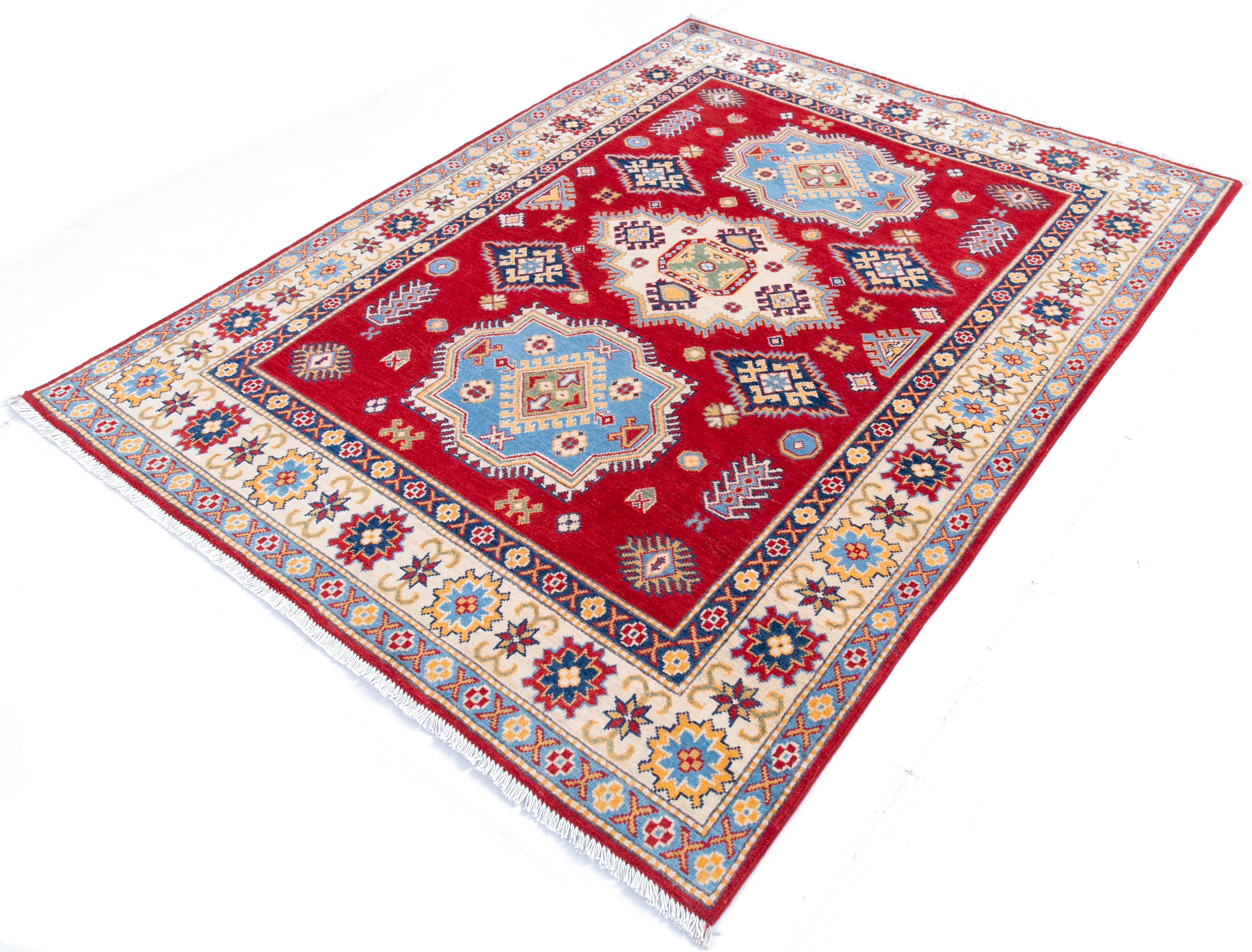 Full view at an angle of red & blue Kazak-inspired wool rug 21543.