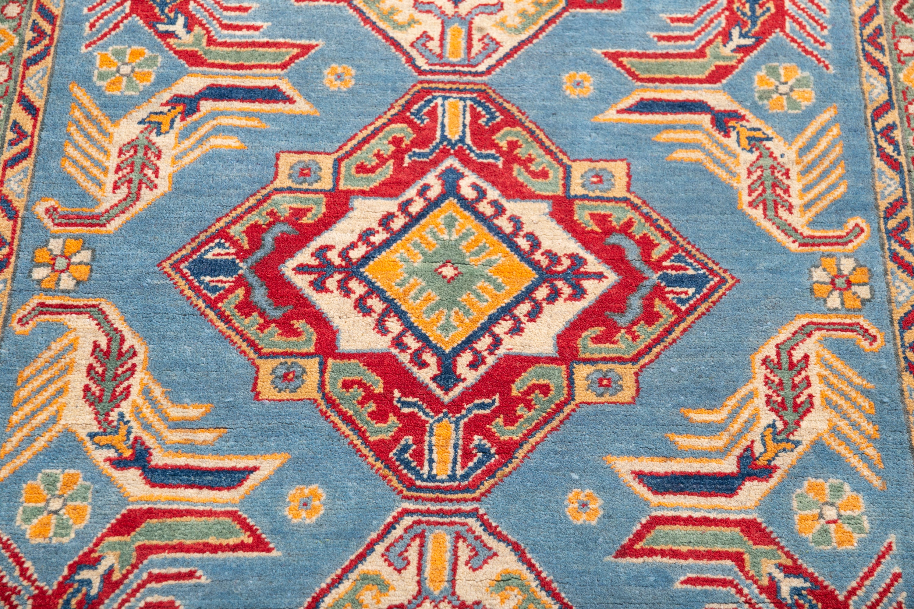 Pattern detail of blue & red Kazak-inspired wool rug 21980.