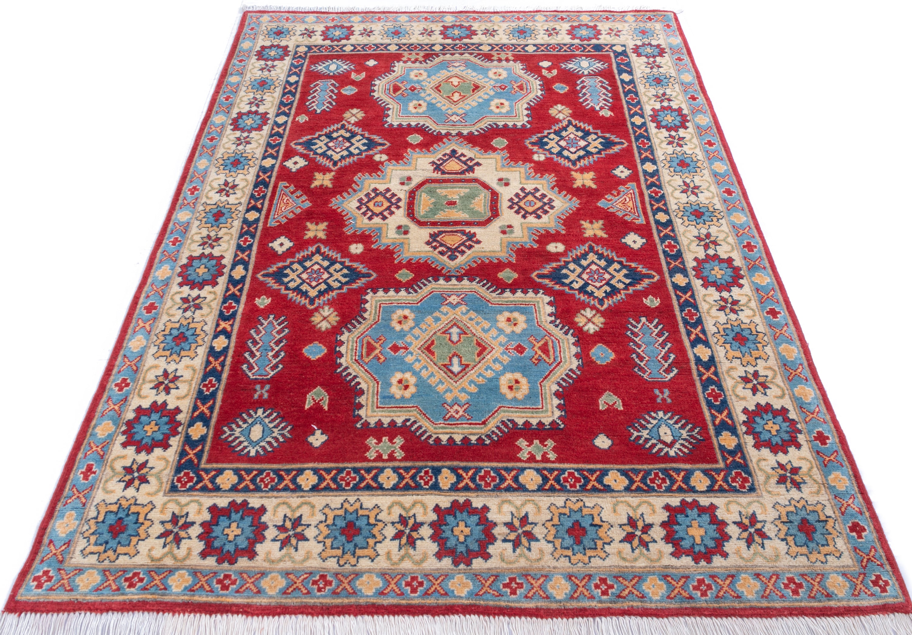 Full view from a low angle of red & blue Kazak-inspired wool rug 21982.