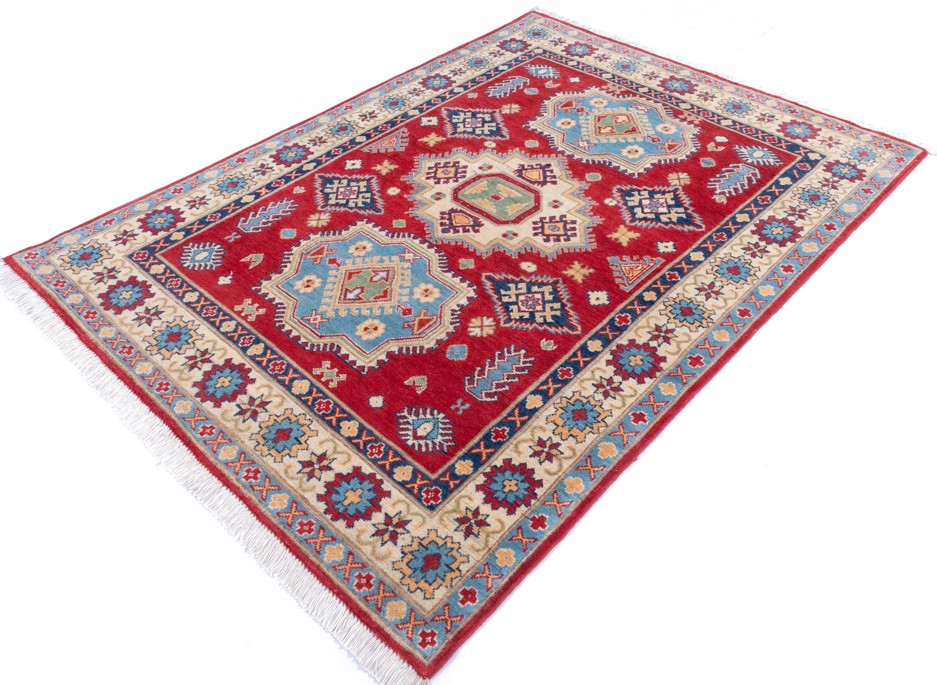 Full view at an angle of red & blue Kazak-inspired wool rug 21982.