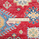 Wool pile close-up of red & ivory Kazak-inspired wool rug 21984.