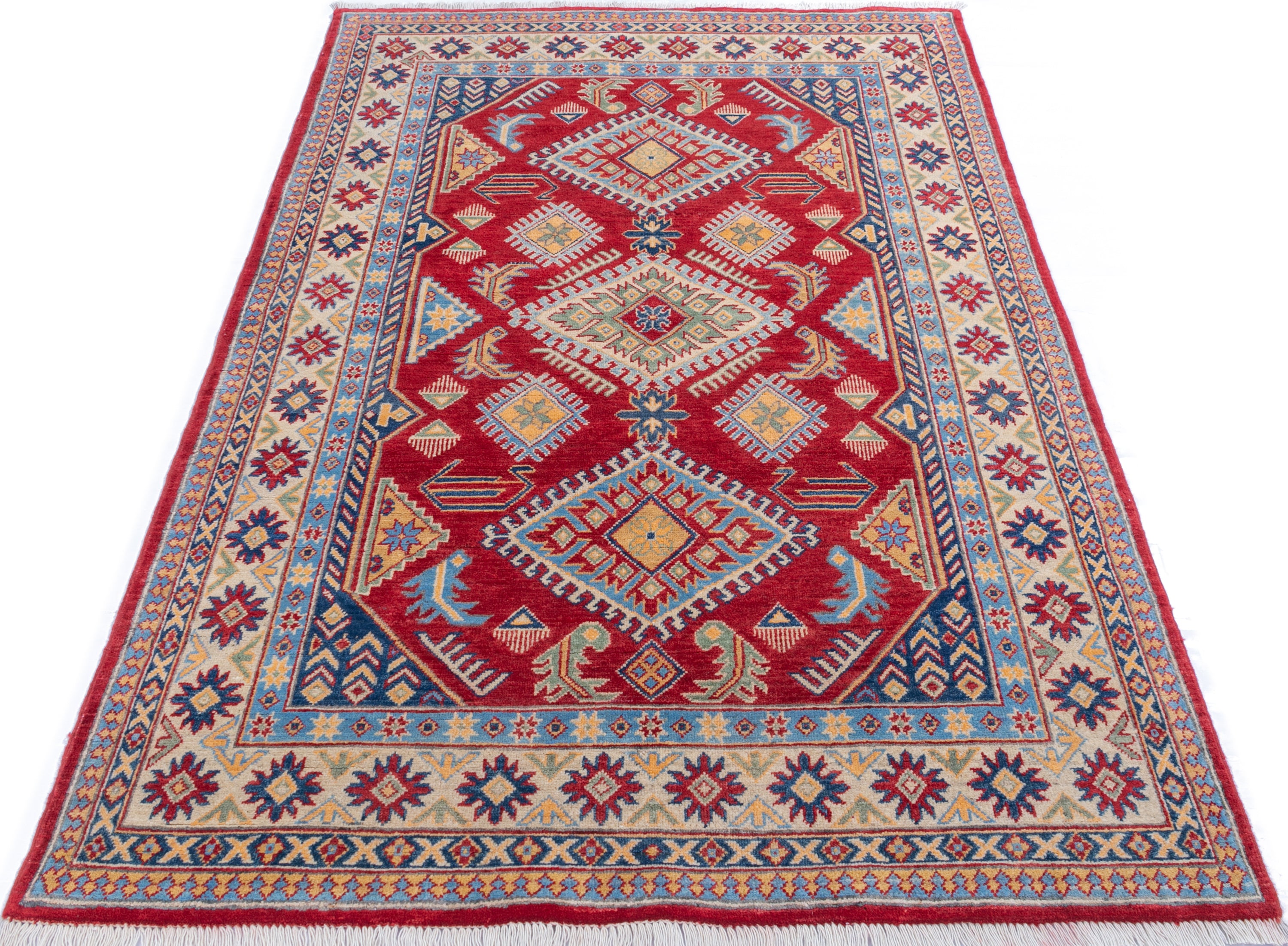 Full view from a low angle of red & blue Kazak-inspired wool rug 21987.