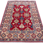 Full view from a low angle of red & ivory Kazak-inspired wool rug 21997.