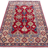 Full view from a low angle of red & ivory Kazak-inspired wool rug 21997.
