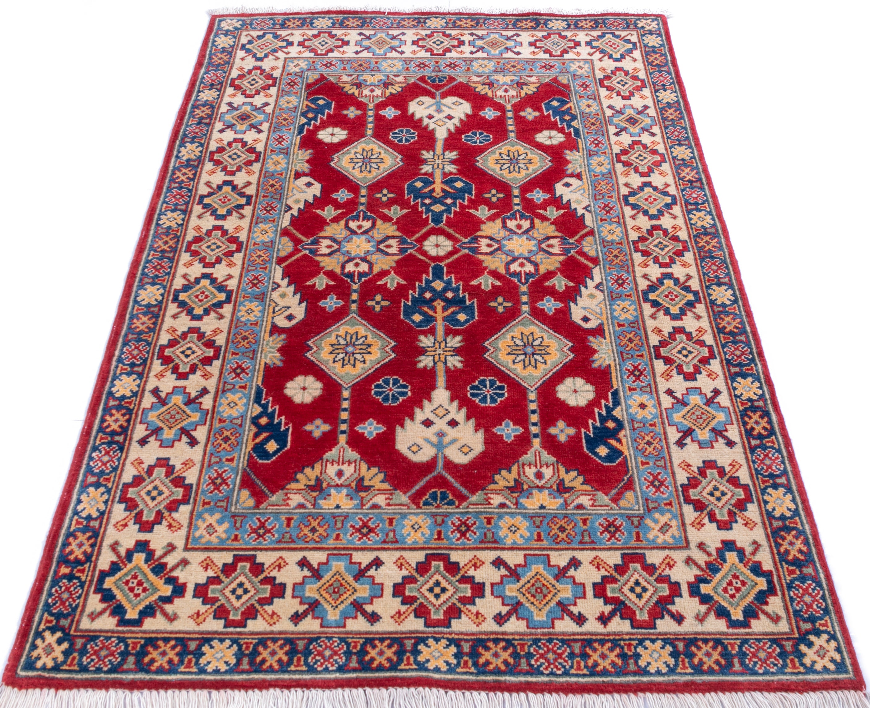 Full view from a low angle of red & ivory Kazak-inspired wool rug 21997.