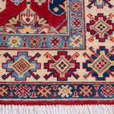 Border and edge detail of red & ivory Kazak-inspired wool rug 21997.