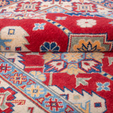 Folded edge and wool pile of red & ivory Kazak-inspired wool rug 21997.
