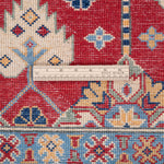 Wool pile close-up of red & ivory Kazak-inspired wool rug 21997.