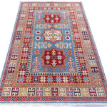 Full view from a low angle of blue & red Kazak-inspired wool rug 22077.