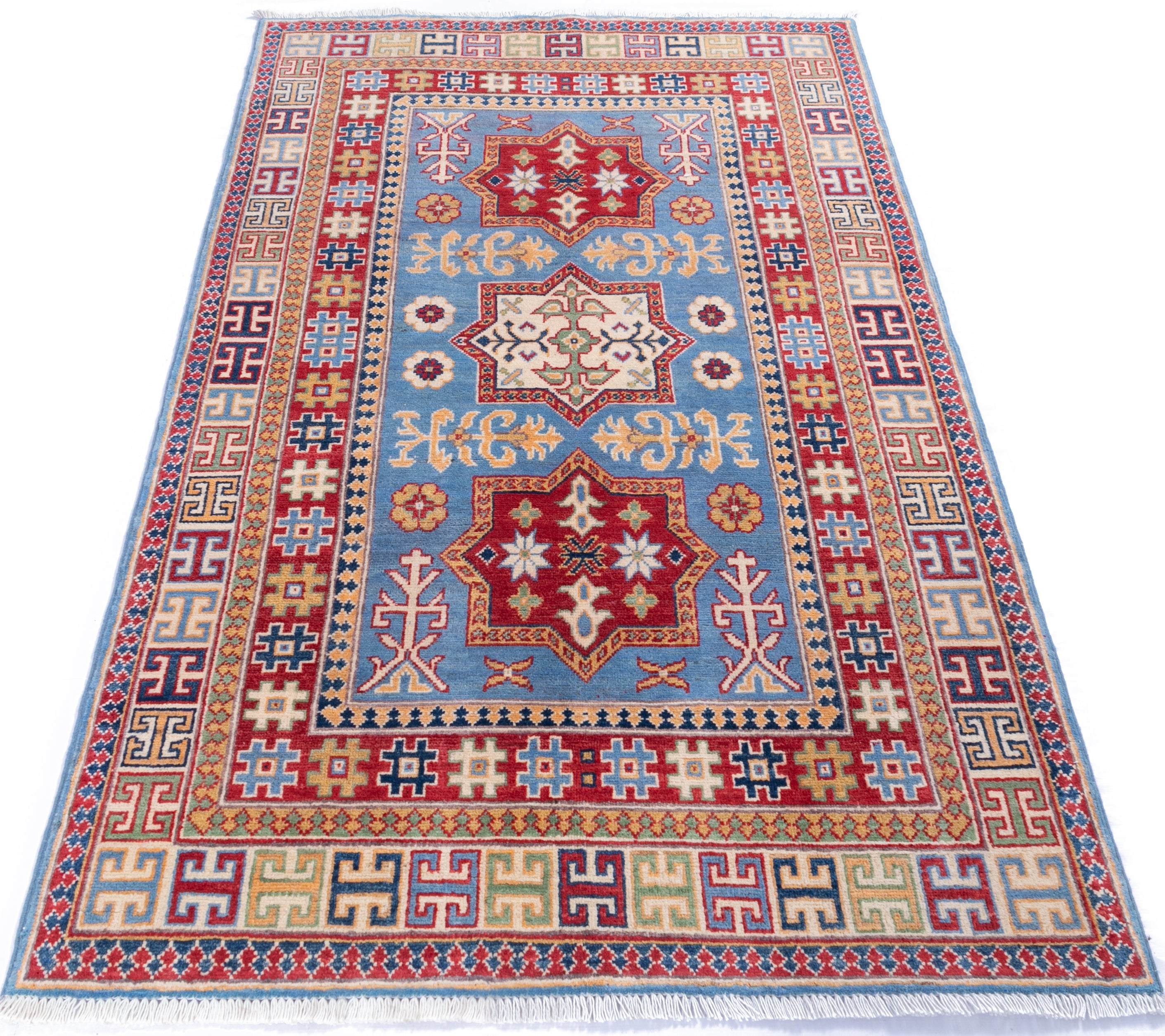 Full view from a low angle of blue & red Kazak-inspired wool rug 22077.