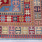 Border and edge detail of blue & red Kazak-inspired wool rug 22077.