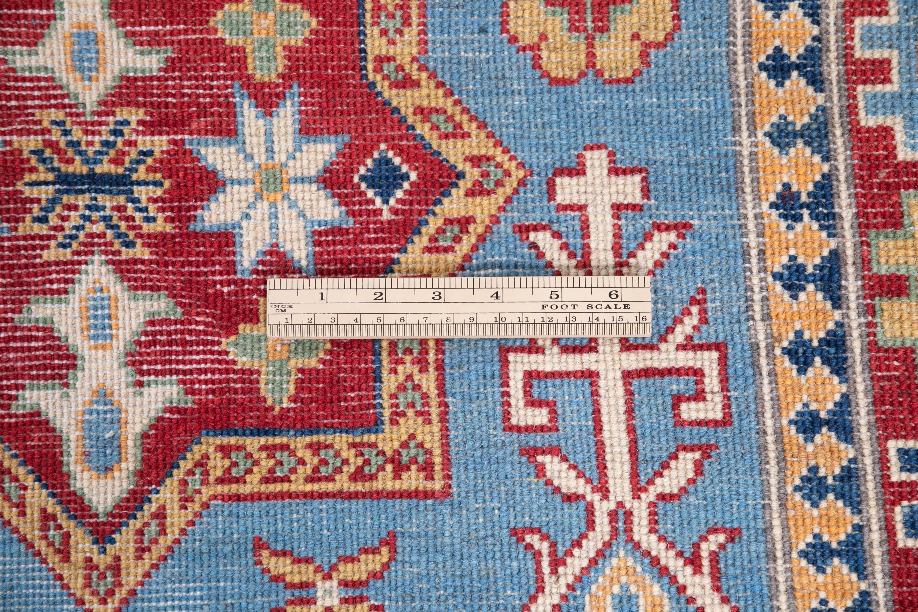 Wool pile close-up of blue & red Kazak-inspired wool rug 22077.