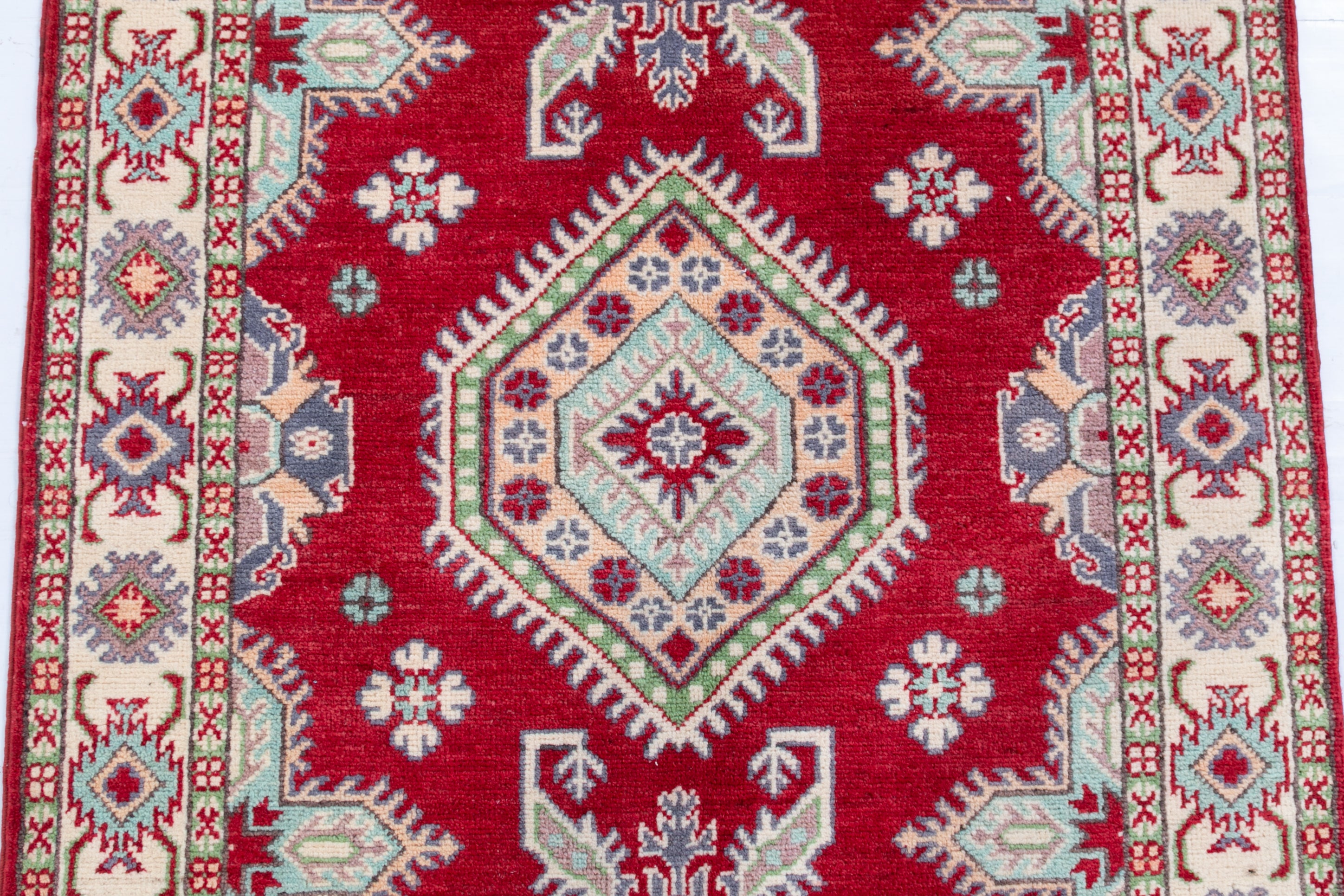 Pattern detail of red & ivory Kazak-inspired wool rug 23375.