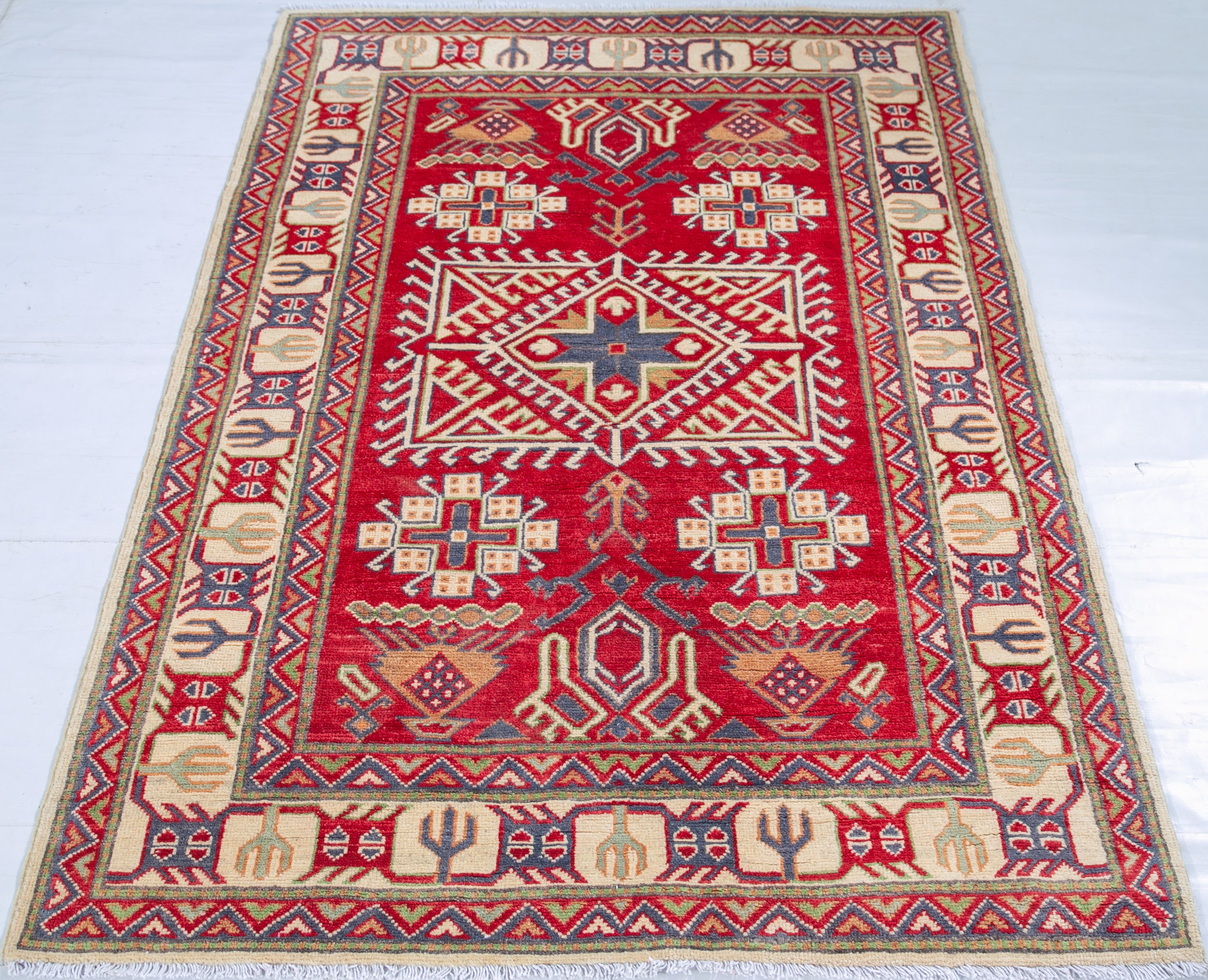 Full view from a low angle of red & ivory Kazak-inspired wool rug 23925.