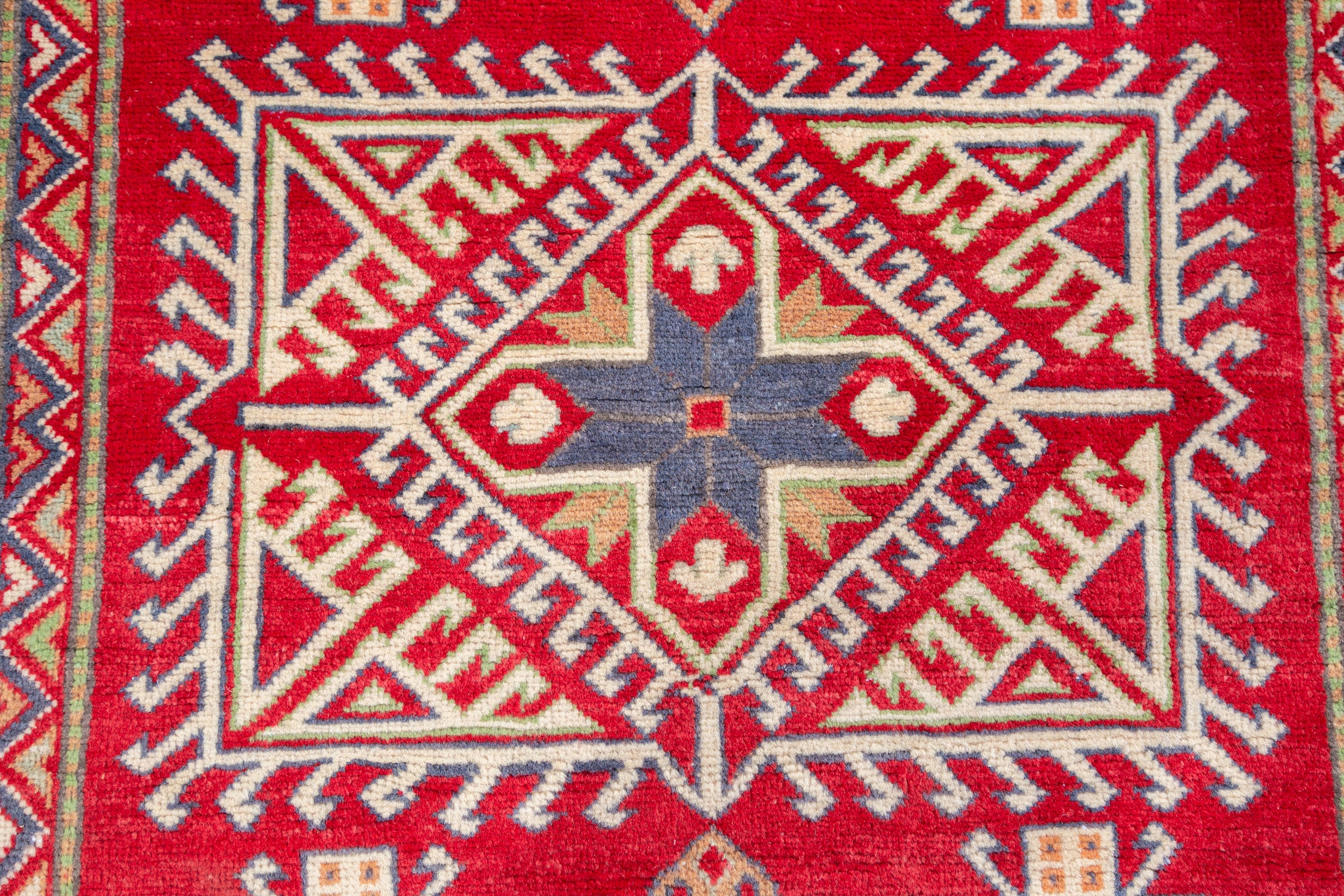 Pattern detail of red & ivory Kazak-inspired wool rug 23925.