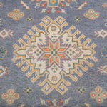 Pattern detail of blue & ivory Kazak-inspired wool rug 26753.