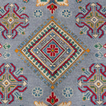 Pattern detail of blue & red Kazak-inspired wool rug 27430.