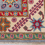 Border and edge detail of blue & red Kazak-inspired wool rug 27430.