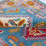 Folded edge and wool pile of blue & red Kazak-inspired wool rug 27434.