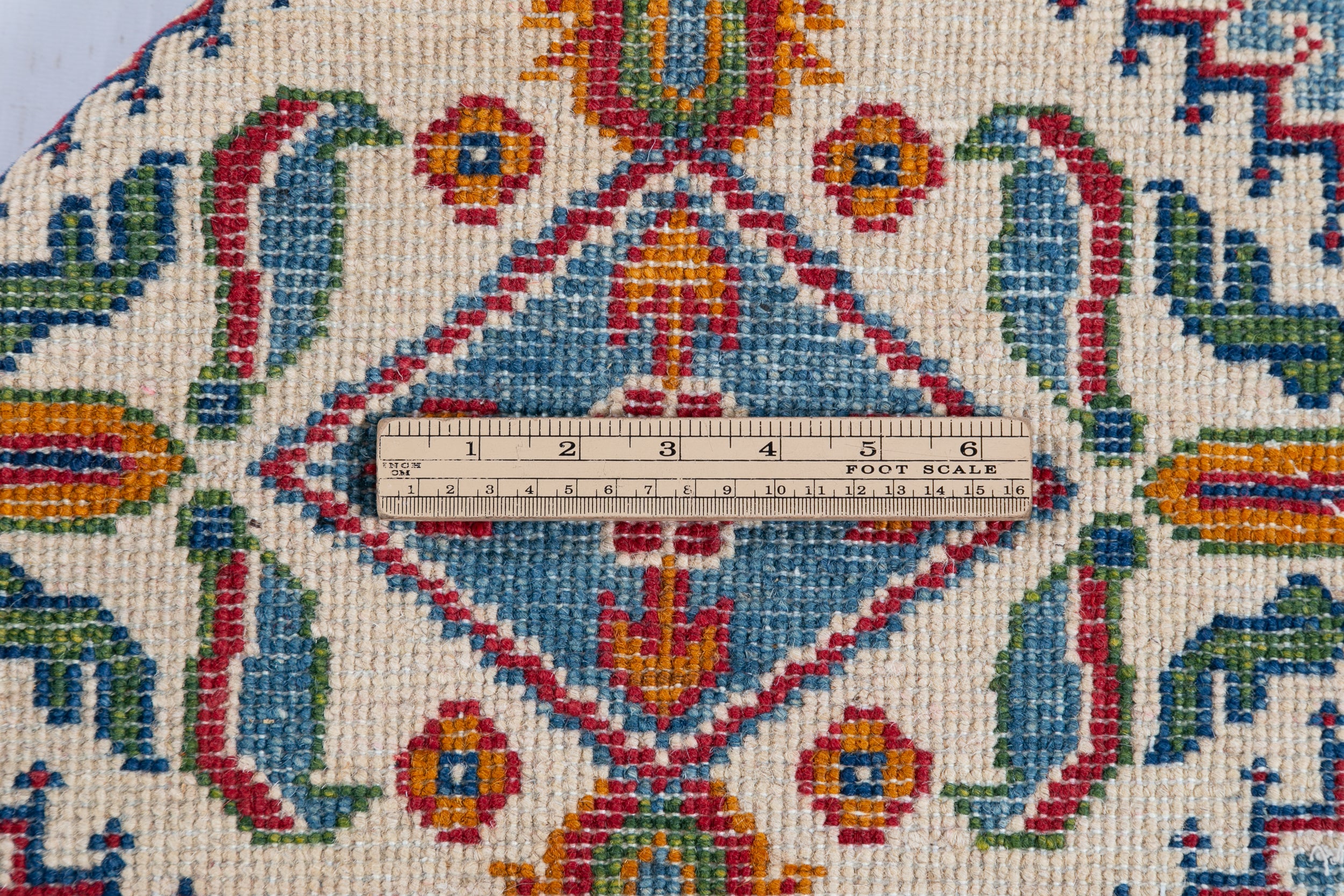 Wool pile close-up of blue & red Kazak-inspired wool rug 27434.