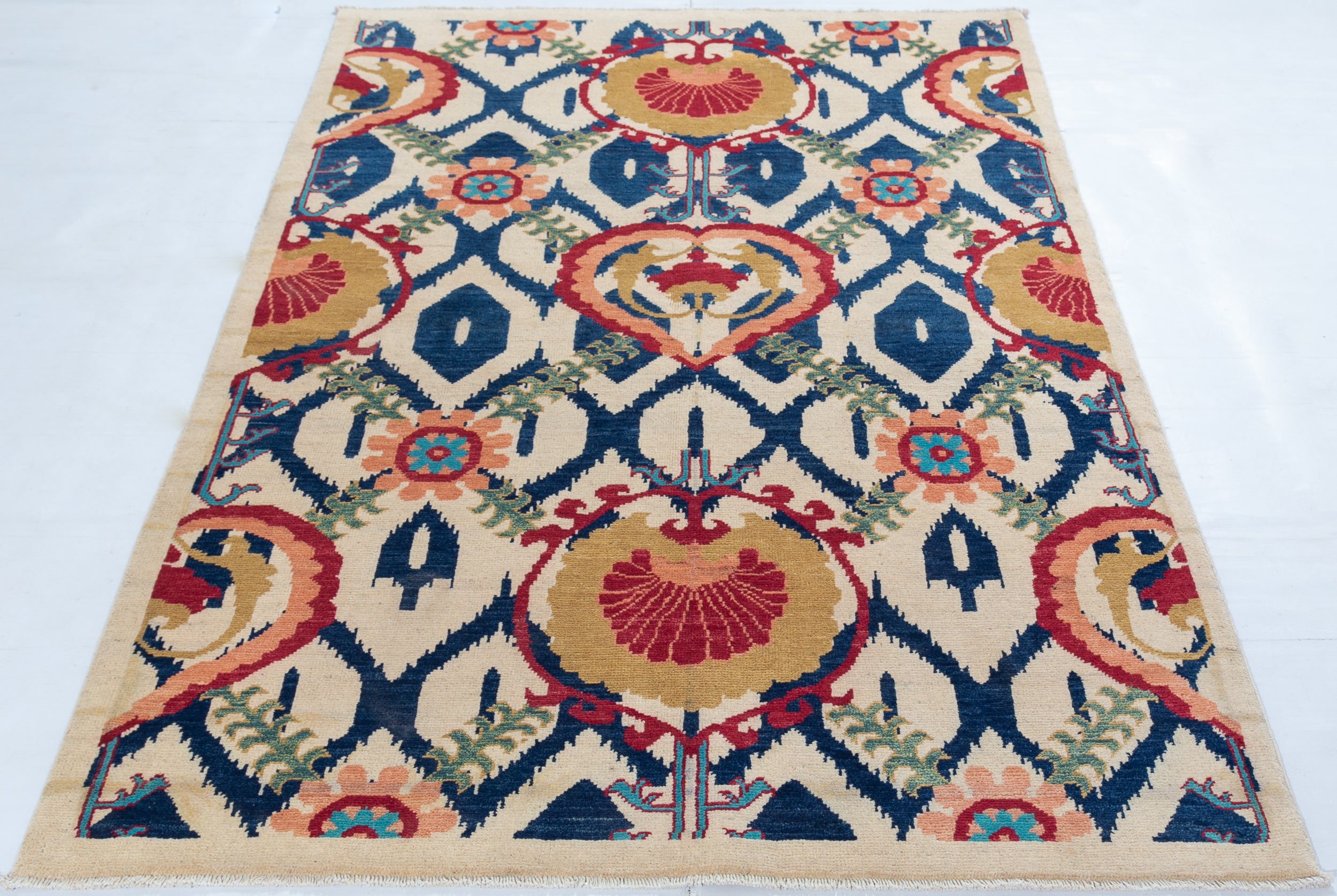 Full view from a low angle of ivory & blue Kazak-inspired wool rug 27444.
