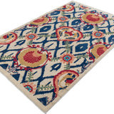 Full view at an angle of ivory & blue Kazak-inspired wool rug 27444.