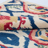 Folded edge and wool pile of ivory & blue Kazak-inspired wool rug 27444.