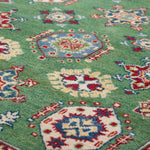 Pattern detail of green & red Kazak-inspired wool rug 29347.